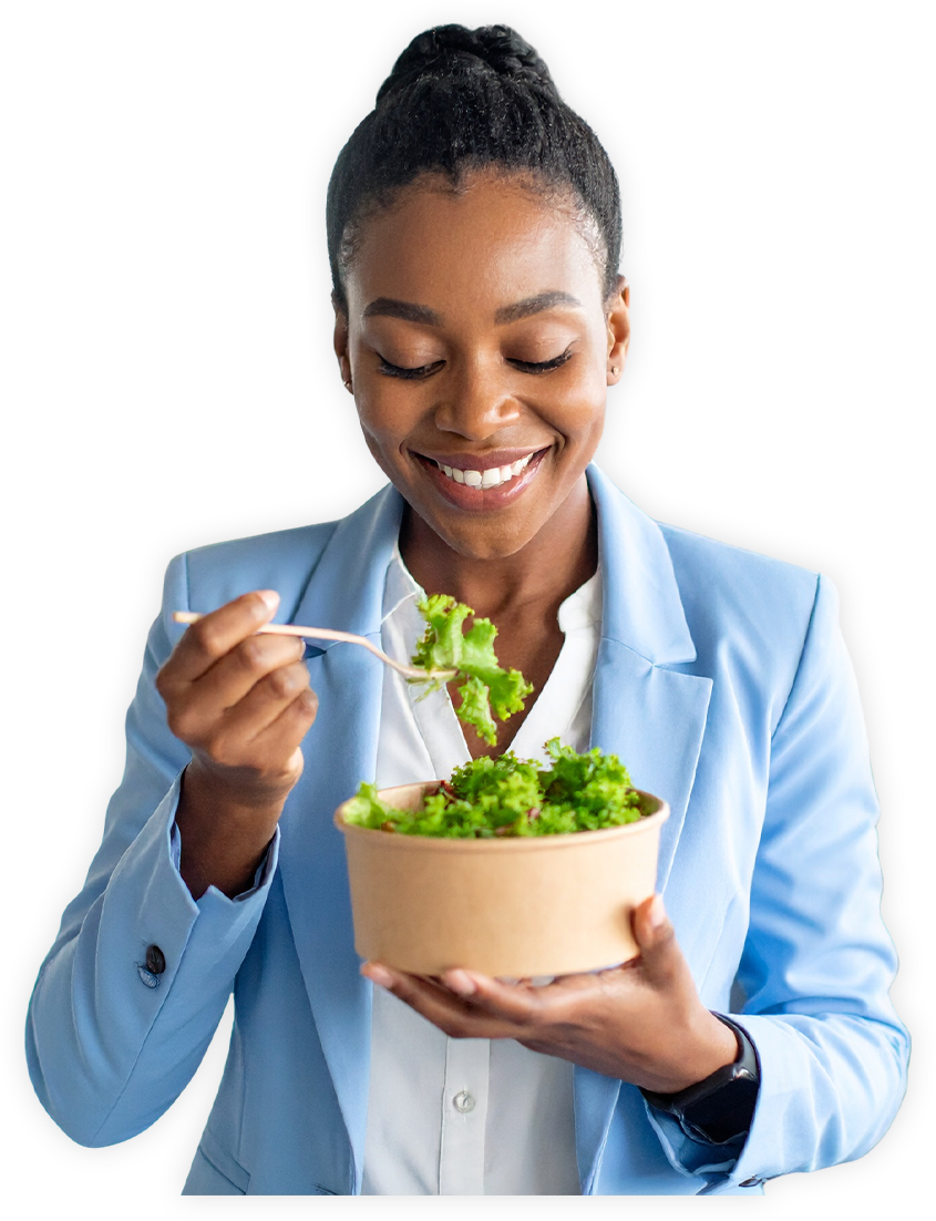 A lady wearing a blue blazer enjoying a salad from office micro market
